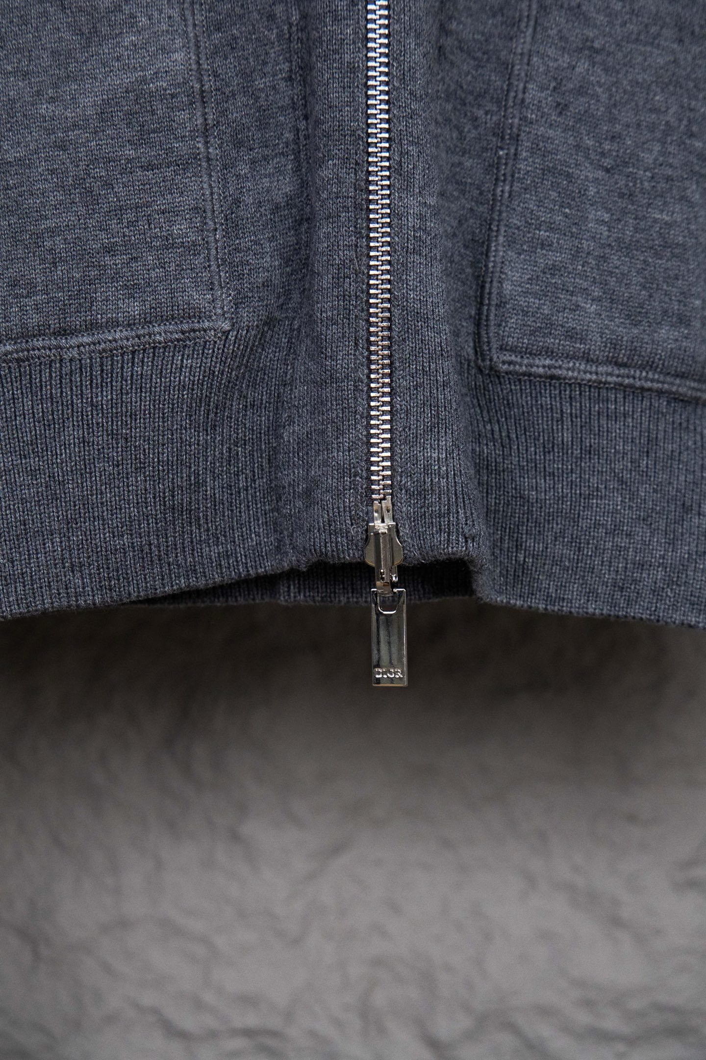 Dark blue zip-front jacket with metal zipper