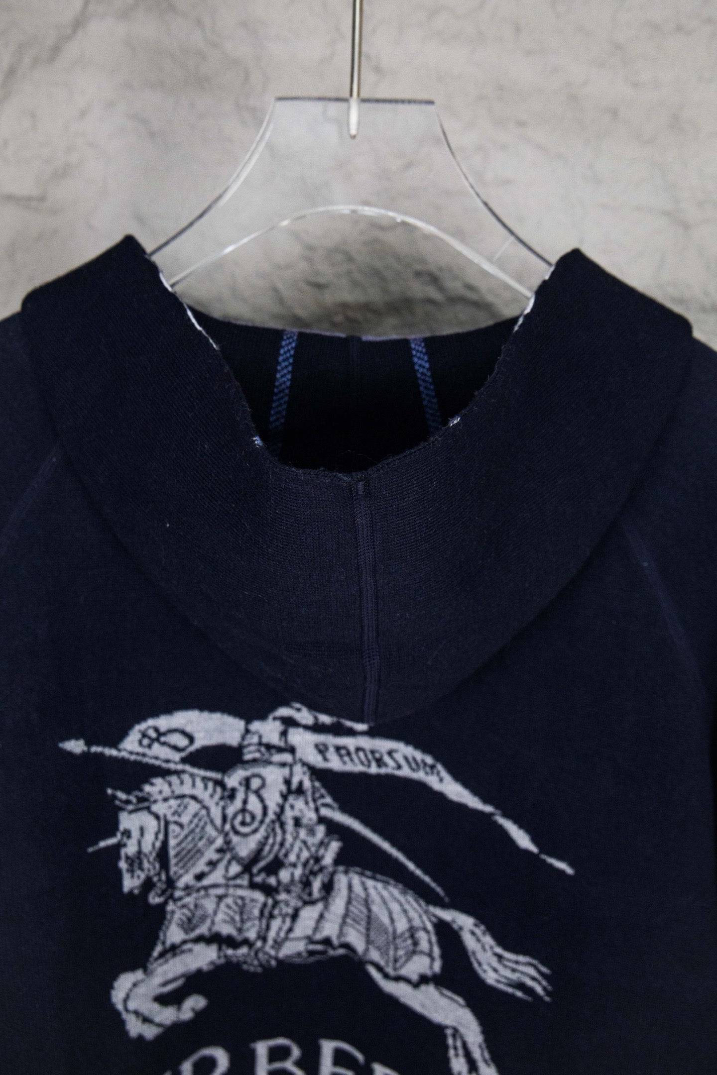 Navy hooded zip-up knit jacket with horse rider graphic and hood interior trim