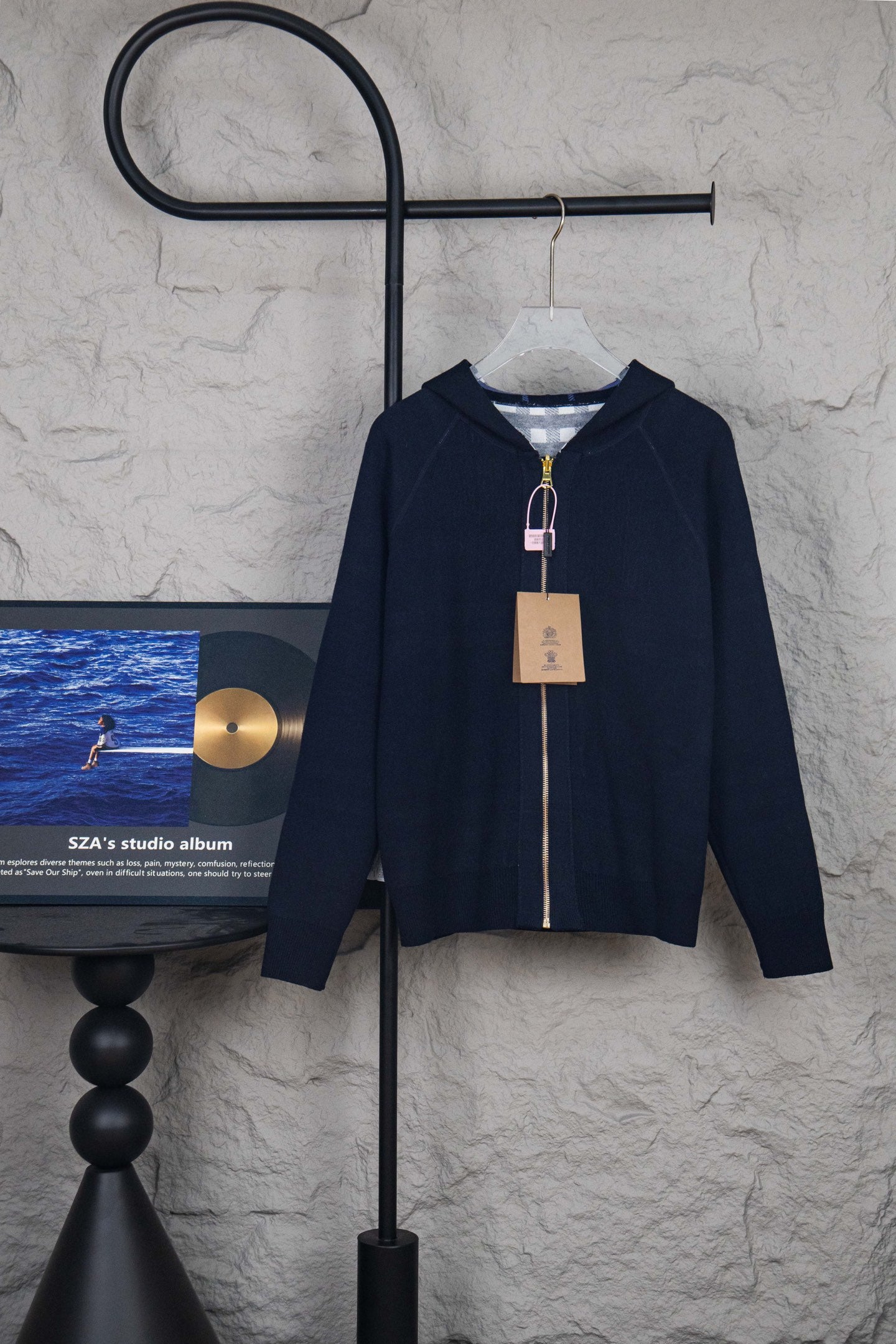 Navy hooded zip-up knit jacket with front zipper and stand collar detail