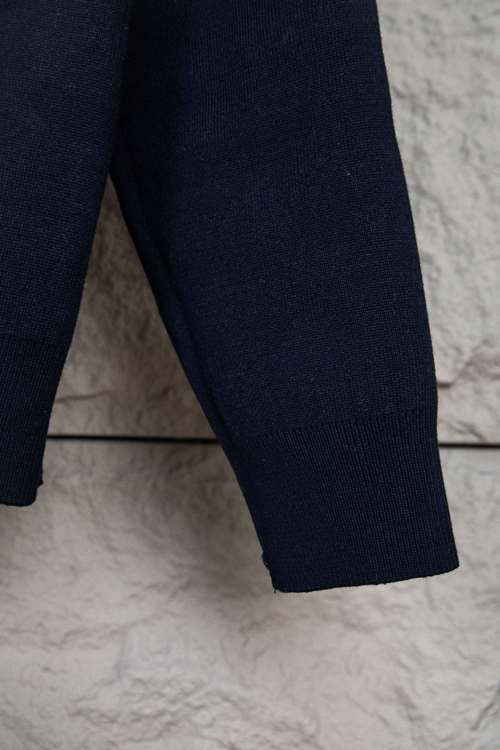 Navy knit pant-style leg hem with ribbed cuff detail