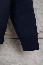 Navy knit pant-style leg hem with ribbed cuff detail
