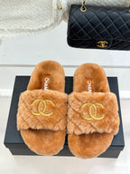 Tan Chanel fuzzy slide slippers with gold Double C logo, front view