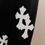 Black sweatshirt sleeve with three white cross appliques