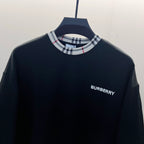 Navy crewneck sweatshirt close-up with Nova Check ribbed collar and Burberry logo on chest