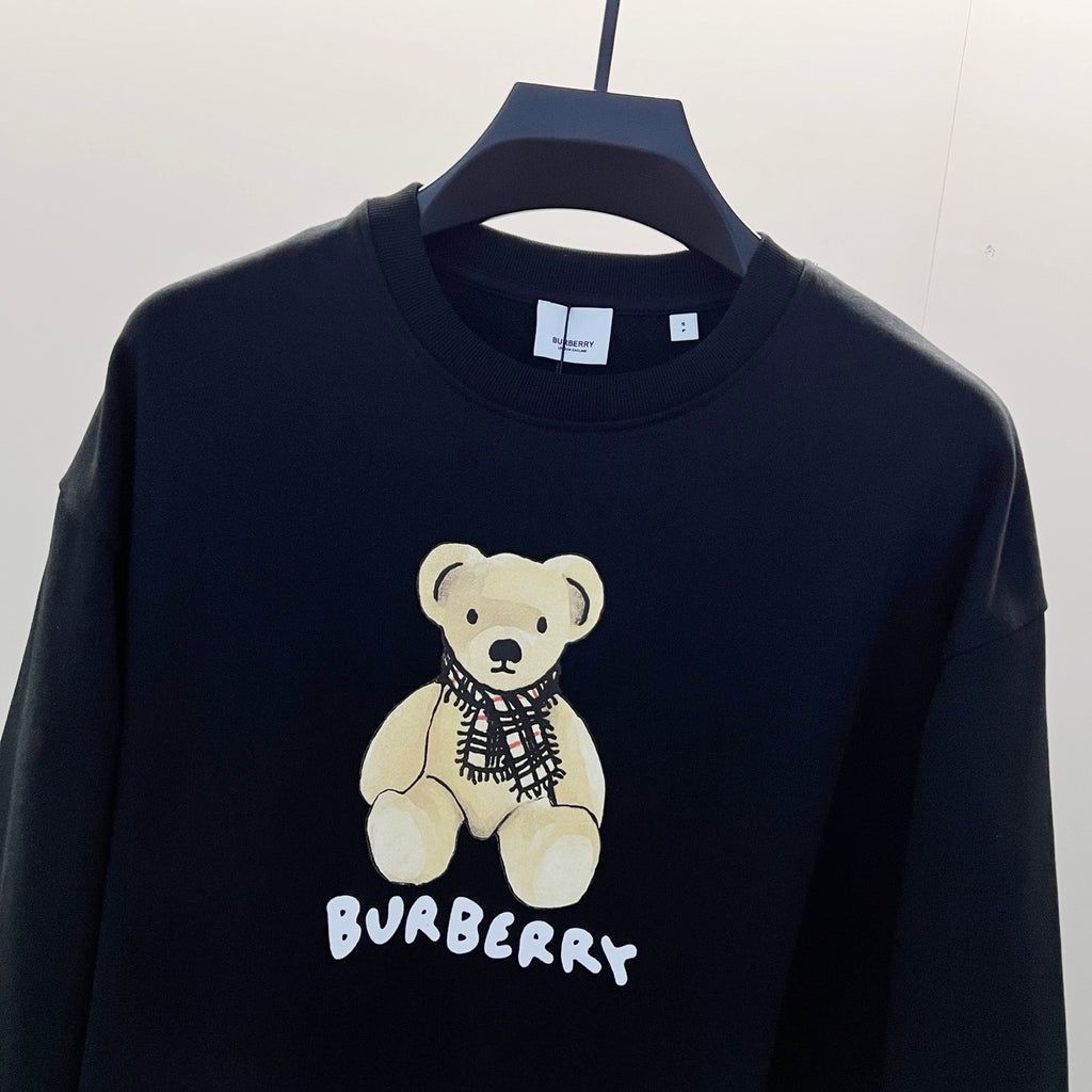 Kids long-sleeve sweatshirt, dark navy, teddy bear graphic with scarf and logo