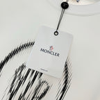 White sweatshirt neckline with hanging tag and MONCLER branding