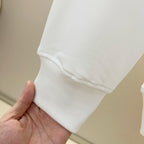 Moncler white sweatshirt hem close-up with ribbed cuff edge