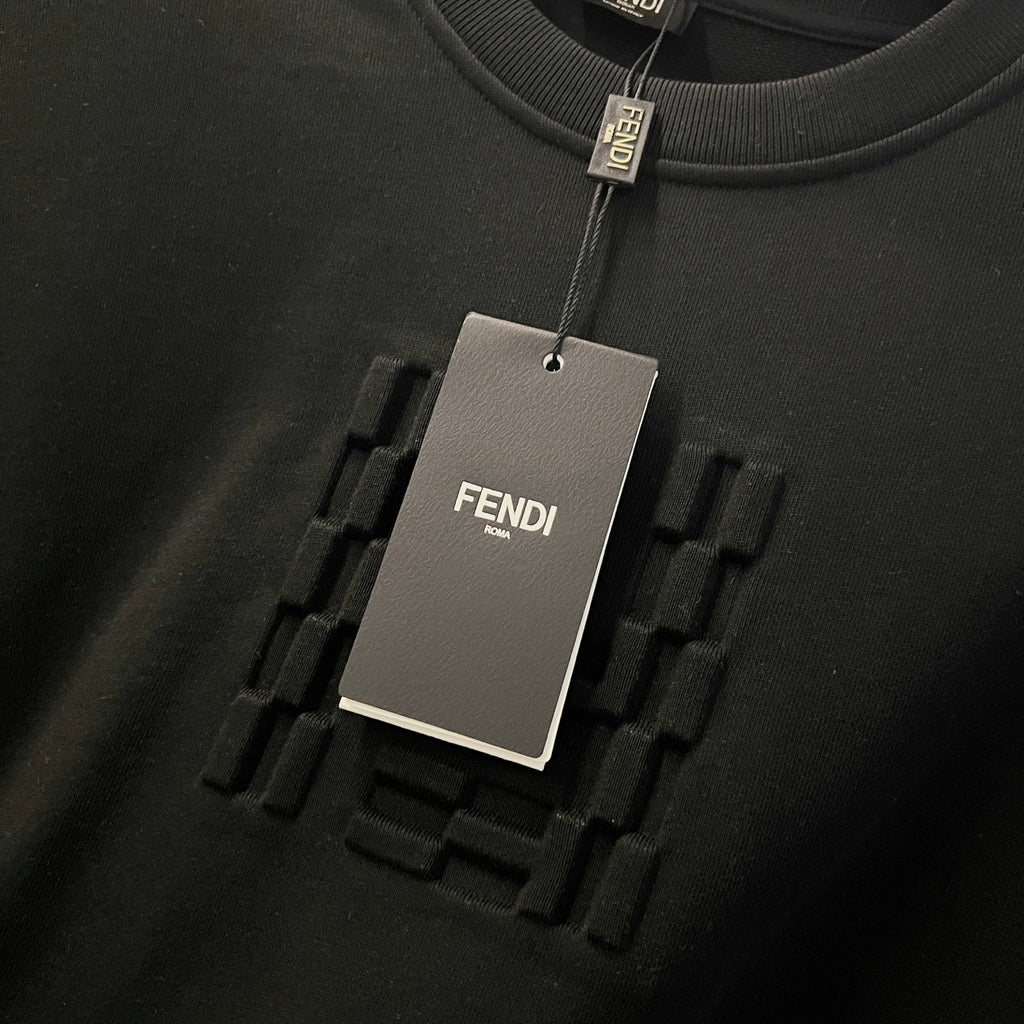 Black sweatshirt hang tag and raised Fendi logo detail on fabric