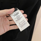 Black sweatshirt with Fendi care tag held in hand