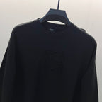 Black crewneck sweatshirt with embossed Fendi logo at chest