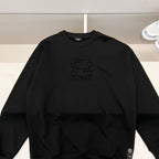 Black crewneck sweatshirt with Fendi logo on chest and small side patch