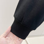 Black sweatshirt sleeve cuff with ribbed knit trim