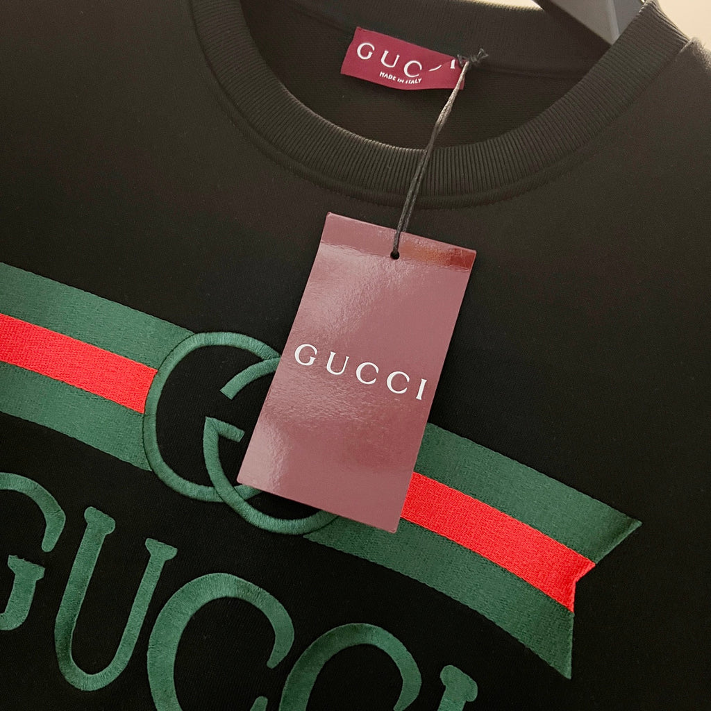 Gucci sweatshirt graphic with green-red GG emblem and Gucci tag