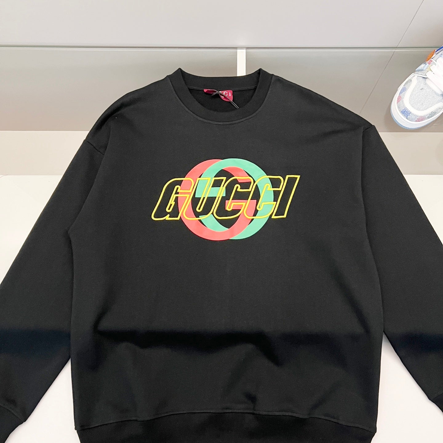 Black sweatshirt with multicolor GUCCI logo chest print, crew neck.