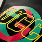 Black sweatshirt close-up of multicolor GUCCI logo graphic in a circular design.