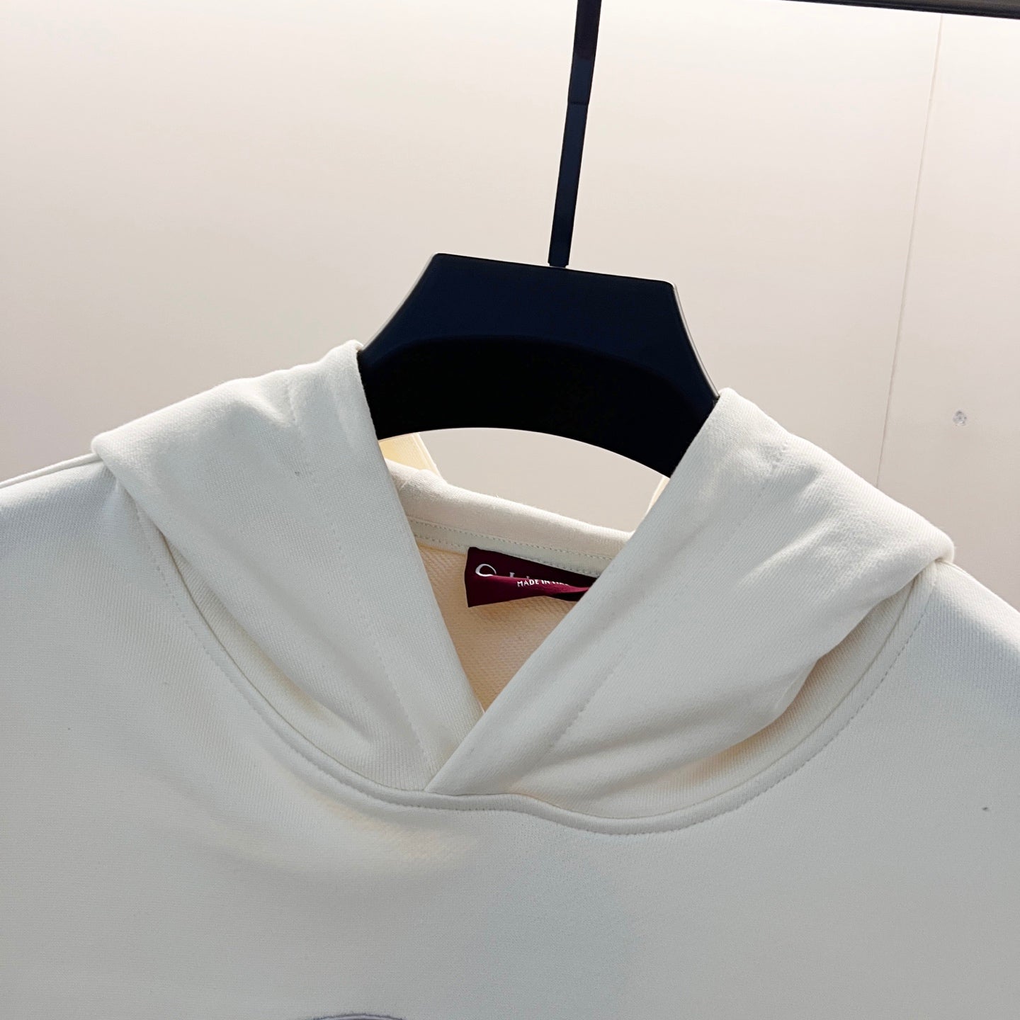 White Gucci hoodie neckline with draped hood and ribbed trim