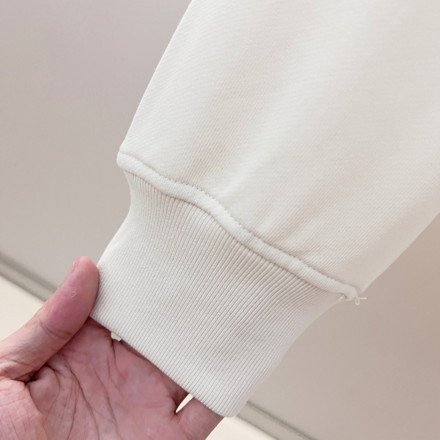 White hoodie sleeve cuff with ribbed knit finish
