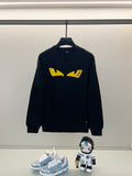 Black Fendi sweatshirt with yellow graphic logo on front