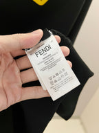 Black Fendi sweatshirt care tag attached inside collar
