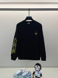 Black long-sleeve shirt with neon yellow cross and sleeve graphic