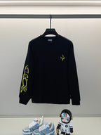Black long-sleeve shirt with neon yellow cross and sleeve graphic