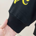 Black ribbed-knit sleeve cuff and straight hem