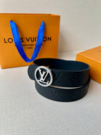 Louis Vuitton dark leather belt with silver logo buckle and embossed monogram texture