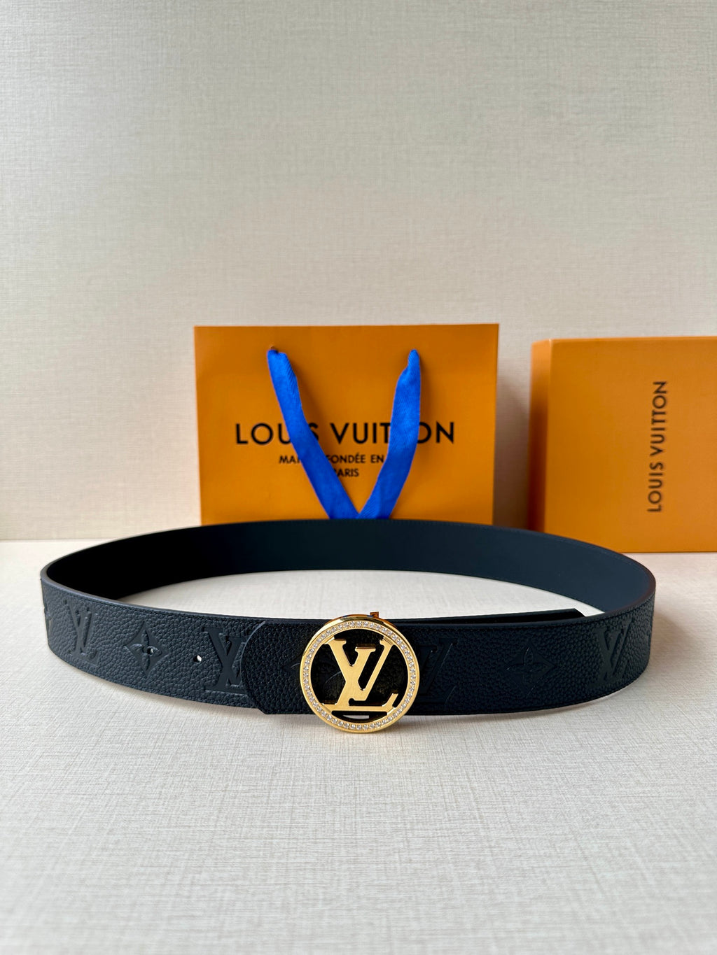 Louis Vuitton dark leather belt with gold logo buckle and monogram emboss