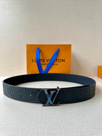 Louis Vuitton belt in dark textured leather with LV buckle on smooth black strap