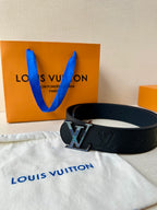 Louis Vuitton belt with dark leather monogram pattern and square LV buckle on strap