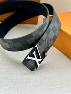 Dark gray check belt with silver LV buckle, showing black underside strap