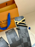 Louis Vuitton Damier belt with gold LV buckle, shown from side angle