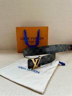 Louis Vuitton Damier belt with gold LV buckle and blue bag behind