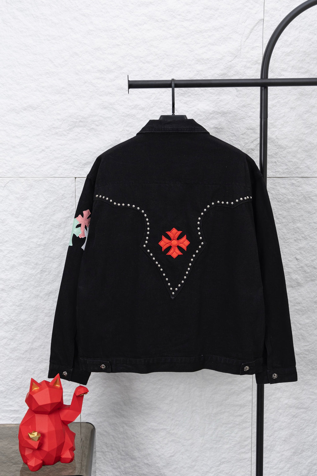 Black long-sleeve button-up shirt, back view with red cross and dotted design