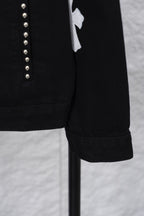 Black long-sleeve jacket sleeve cuff with stitched hem detail