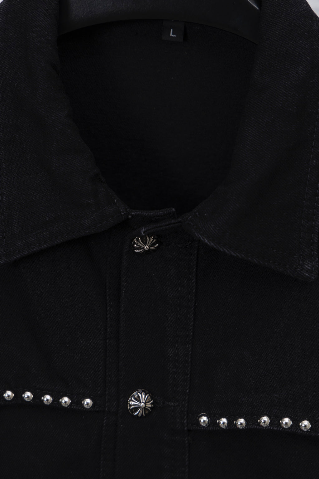 Black button-up collar detail with center placket emblem and stud accents