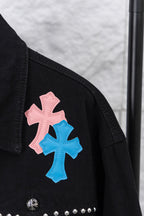 Black short sleeve shoulder area with pink and blue cross patch