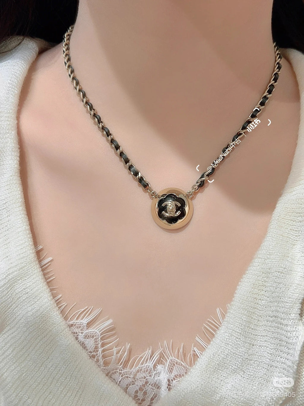 Gold chain necklace with round CC pendant at the neckline