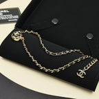Gold chain necklace with round CC pendant and small Chanel logo charm