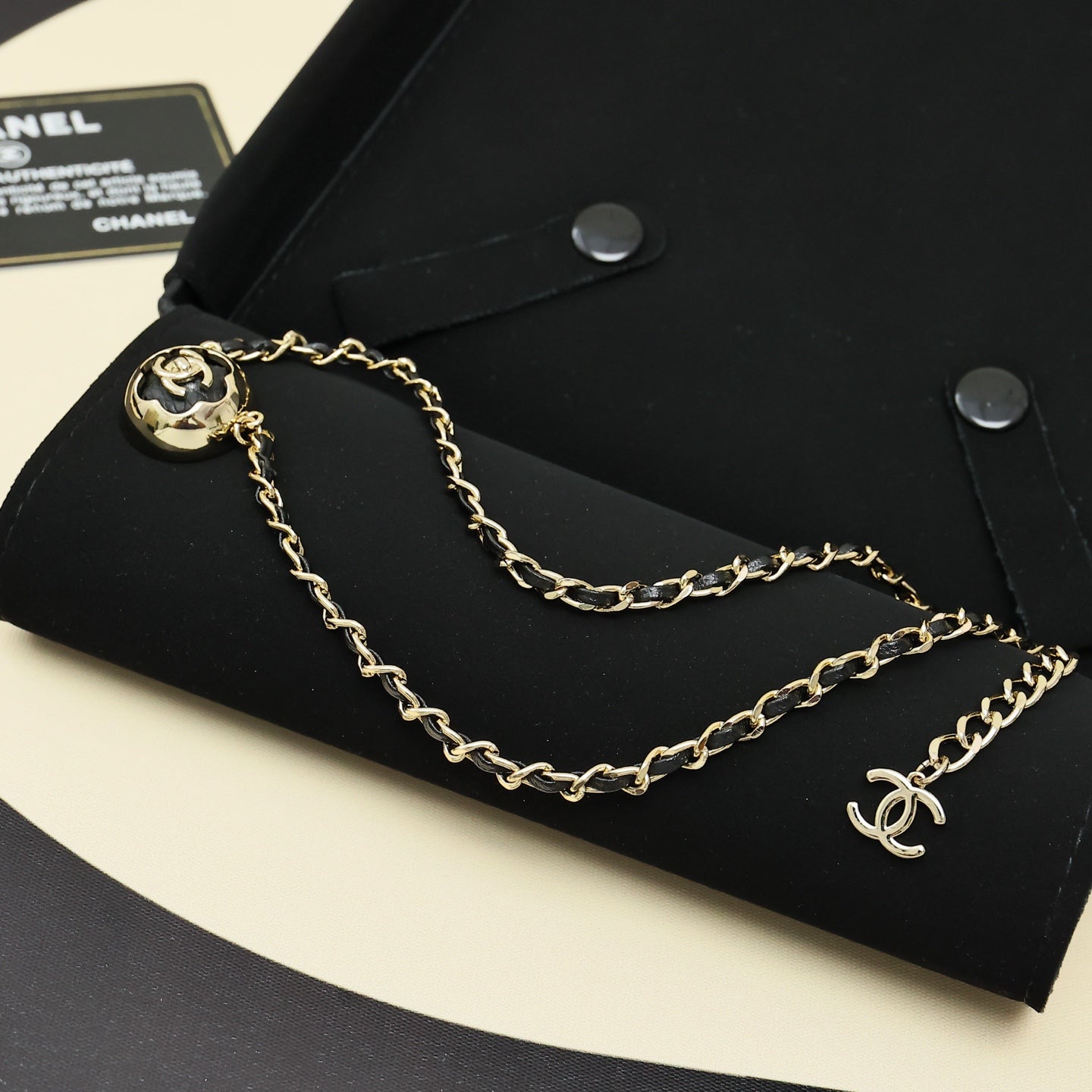 Gold chain necklace with round CC pendant and small Chanel logo charm