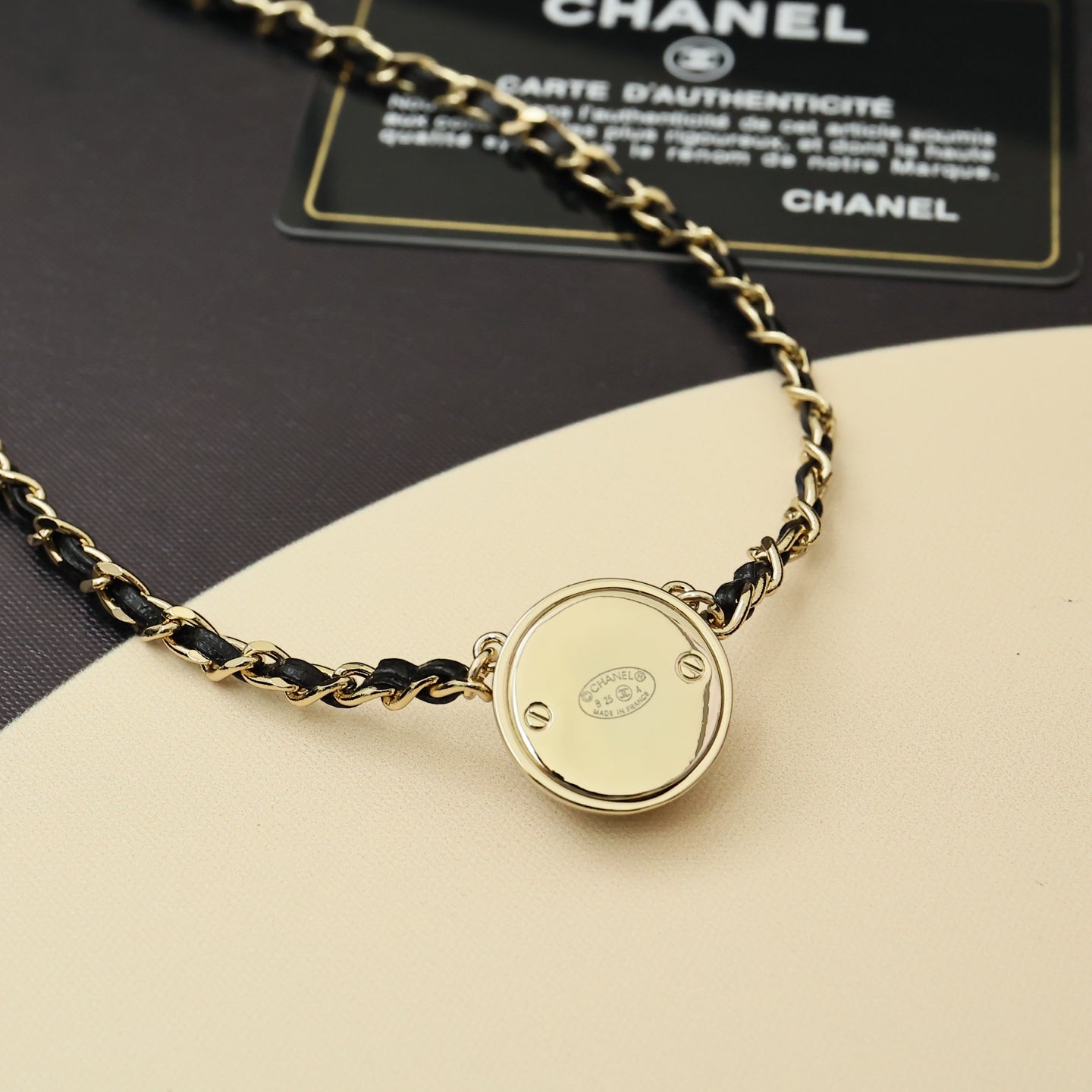 Gold chain necklace with round backplate charm pendant and linked chain