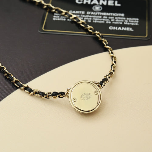 Gold chain necklace with round backplate charm pendant and linked chain
