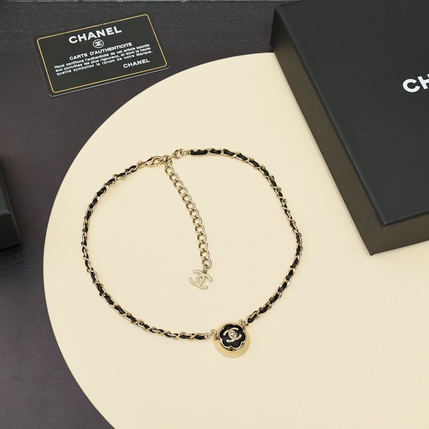 Gold chain necklace with CC logo round pendant and interlocking chain links