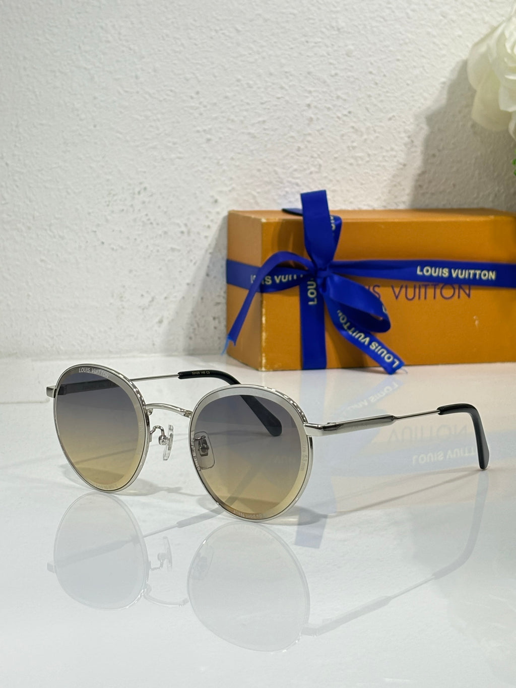 Louis Vuitton round sunglasses, silver frame, dark lenses with slim metal arms