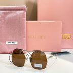 MiuMiu gold-tone sunglasses with brown tinted round lenses
