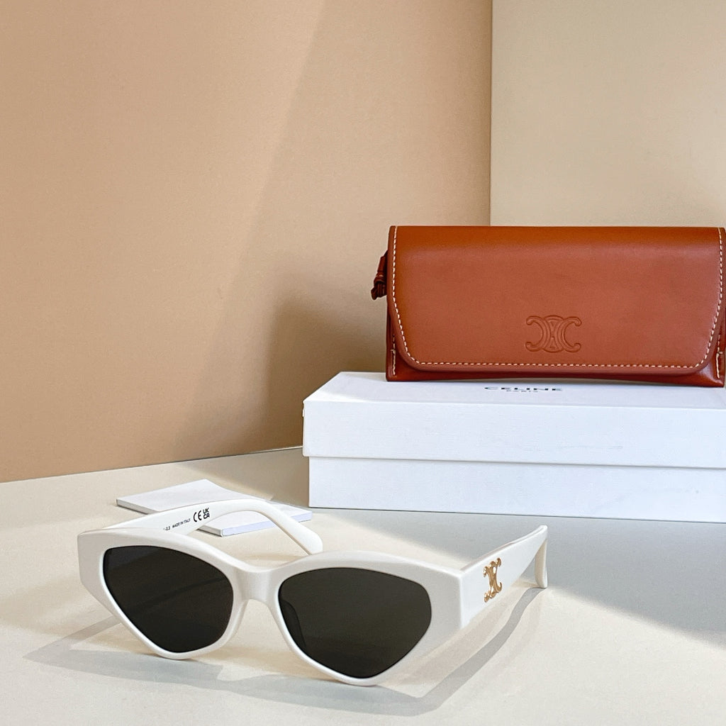 White cat-eye sunglasses with dark lenses and gold logo on temples