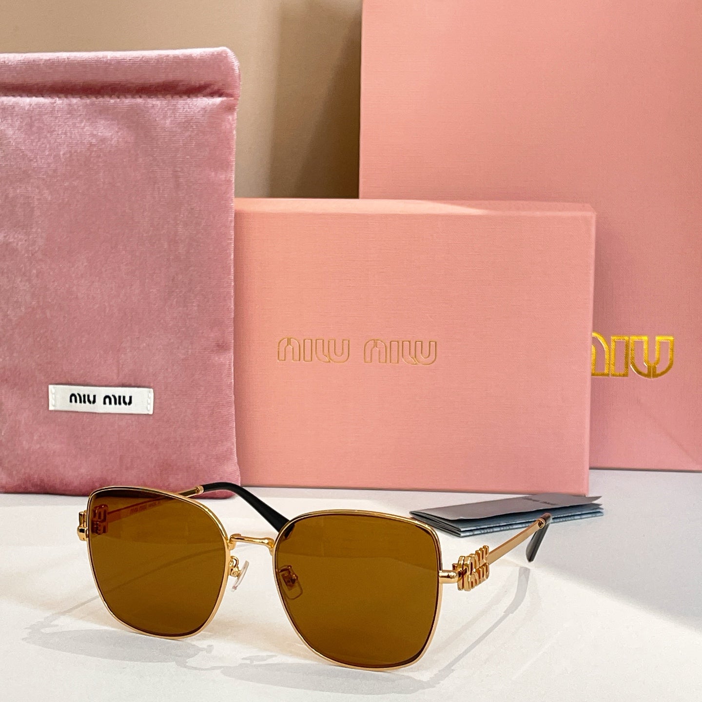 Square sunglasses with gold frame and olive green gradient lenses.