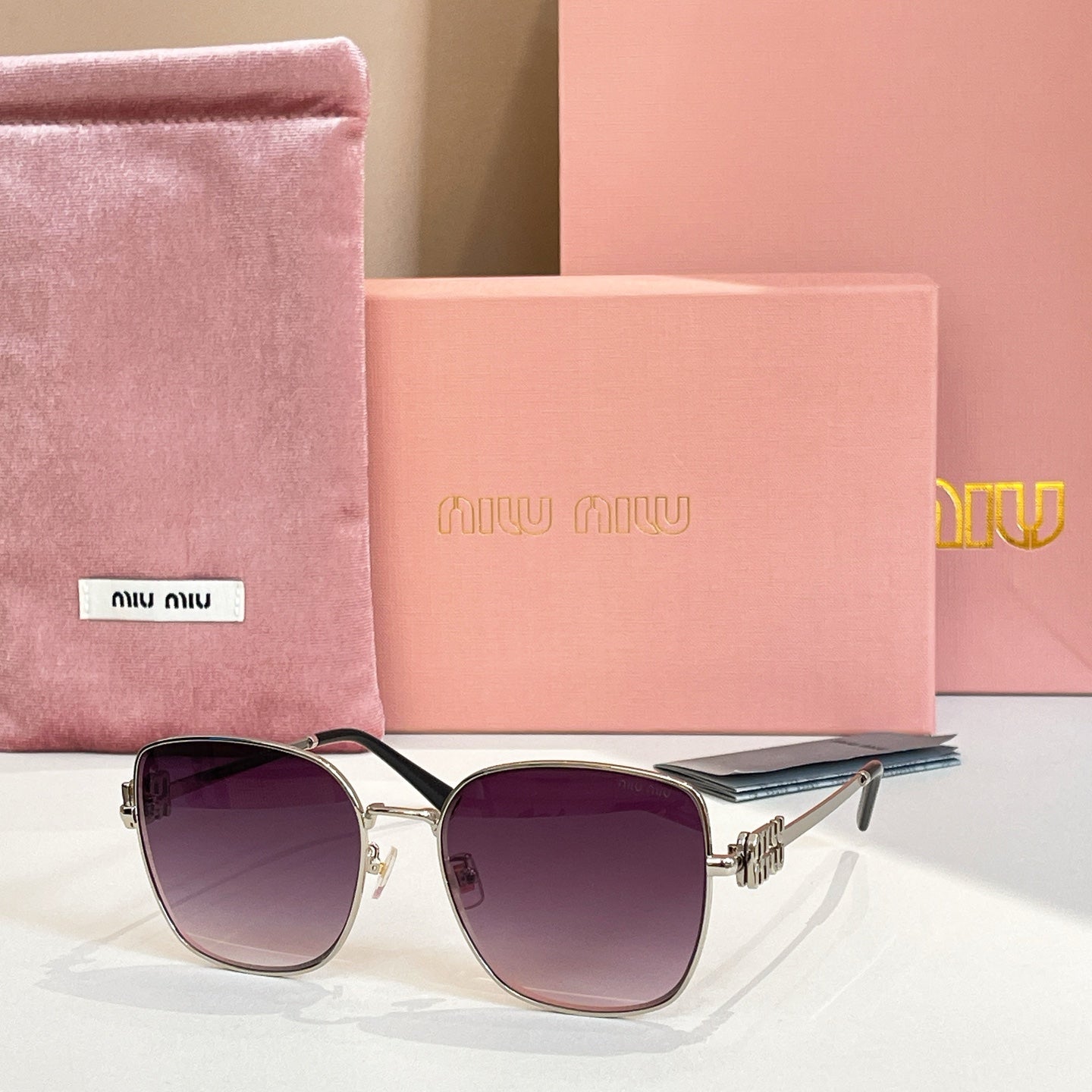 Square sunglasses with silver frame and purple gradient lenses.