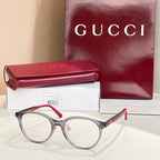 Gucci eyeglasses with gray frames and red temple tips, clear round lenses