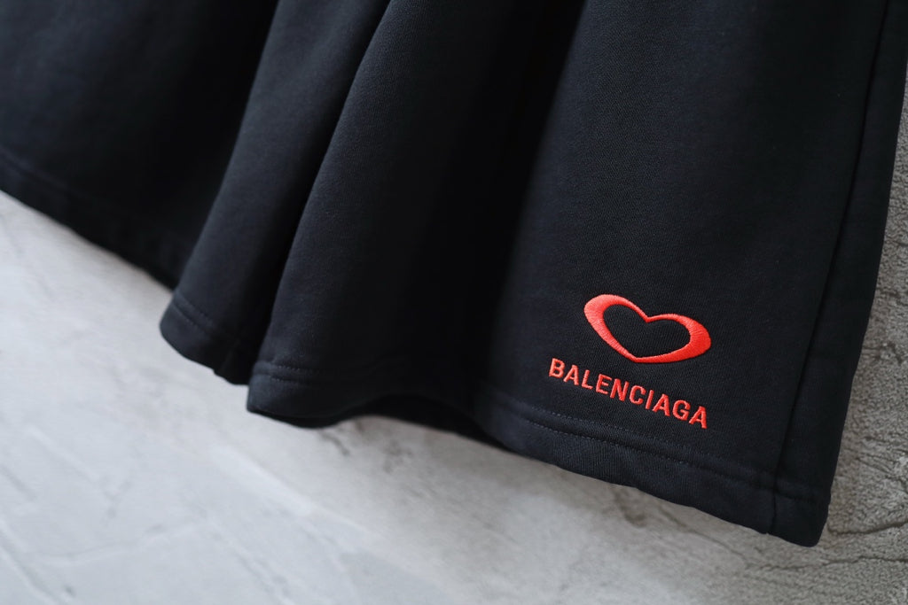Balenciaga shorts hem with red heart logo and BALENCIAGA text embroidery